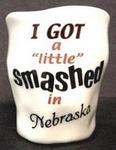 57908NE - NE Shot Glass "Smashed"